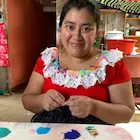 Beading multistrand earrings in Guatemala